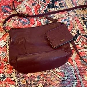 maroon colored Fossil cross body bag with matching wallet